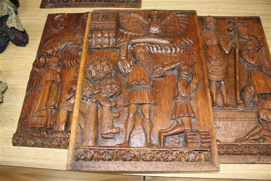 A set of four 19th century Continental relief carved oak religious plaques, depicting biblical scenes, 38 x 29cm
